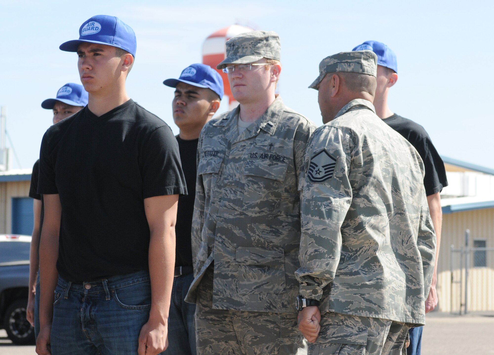 Chaplain (1st Lt.) Nathan Mestler receives some words of “encouragement” from former Air Force Military Training Instructor Master Sgt. Gilbert Alcaraz. (U.S. Air Force photo/Master Sgt. Desiree Twombly)