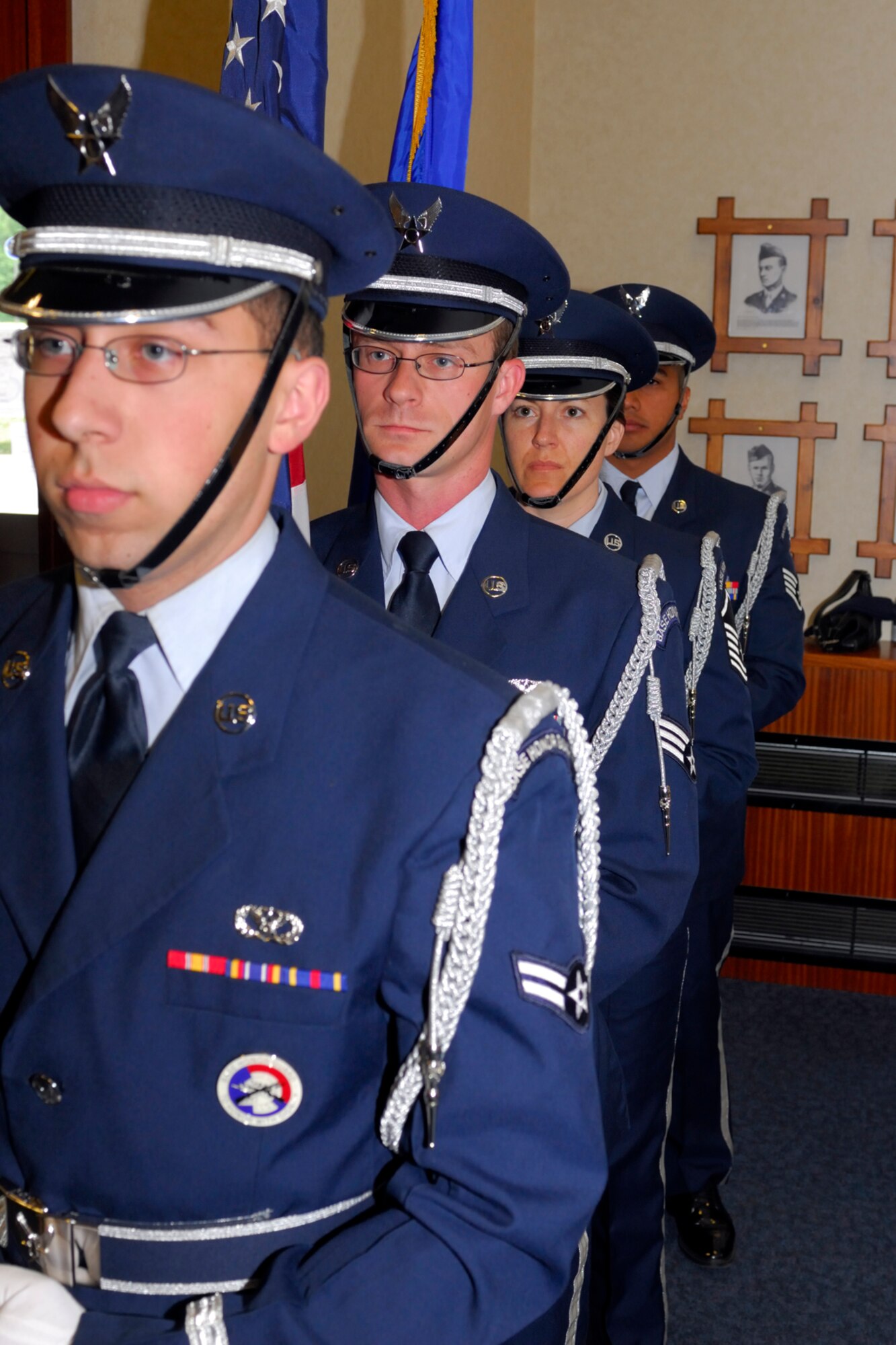 RAF CROUGHTON, United Kingdom - Members of the 422nd Air Base Group Honor Guard present the colors during a change of command ceremony for the 422nd Communications Squadron July 5 at the Croughton Community Center. Major Adisa Hinton replaced Colonel Stephen Conkling as commander of the 422nd CS. (U.S. Air Force photo by Randy Hillsgrove)