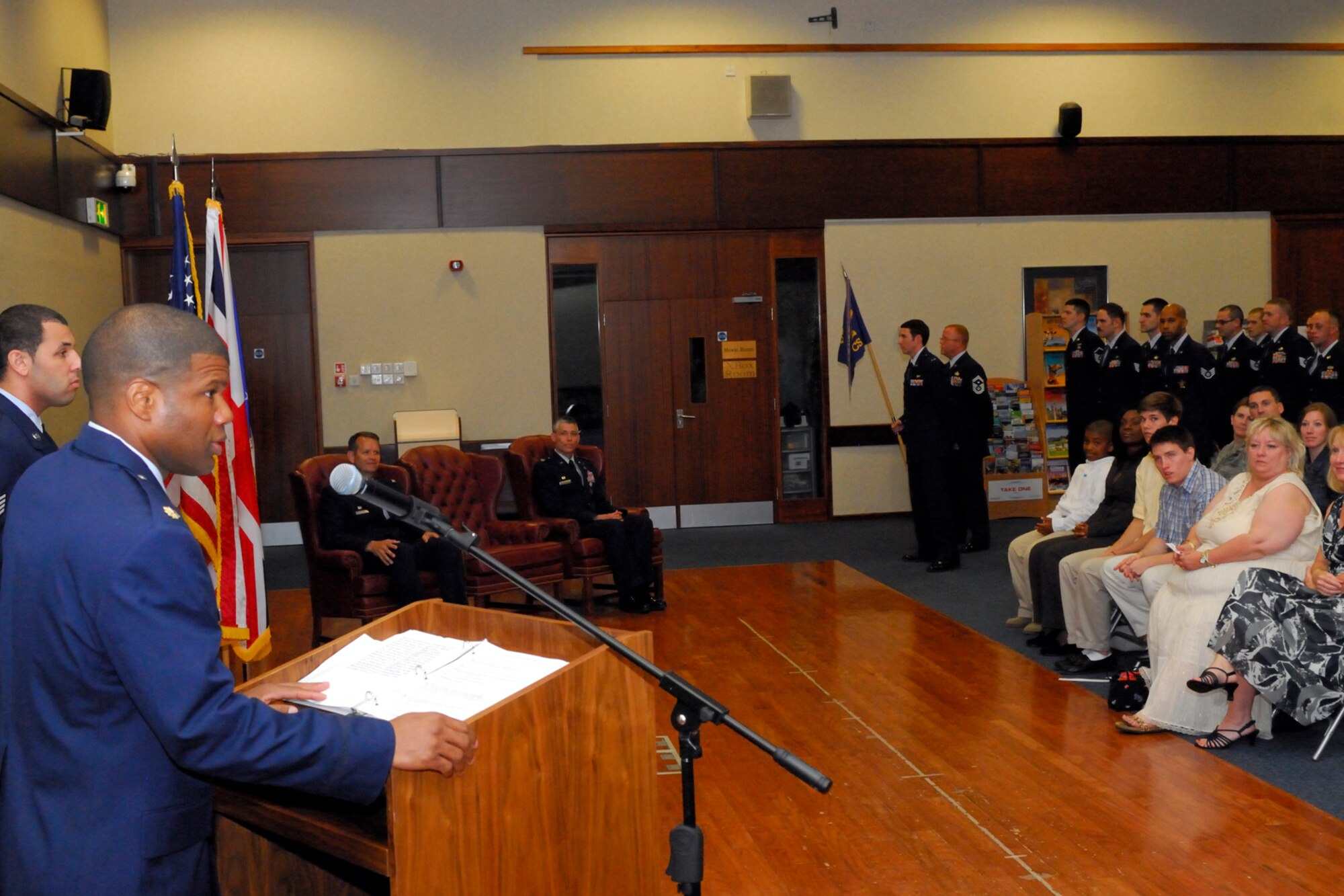 RAF CROUGHTON, United Kingdom - Major Adisa Hinton addresses his new Airmen as the commander of the 422nd Communications Squadron during a change of command ceremony July 5 at the Croughton Community Center. Hinton replaces Col. Stephen Conkling as the commander of the 422nd CS. (U.S. Air Force photo by Master Sgt. Randy Hillsgrove)
