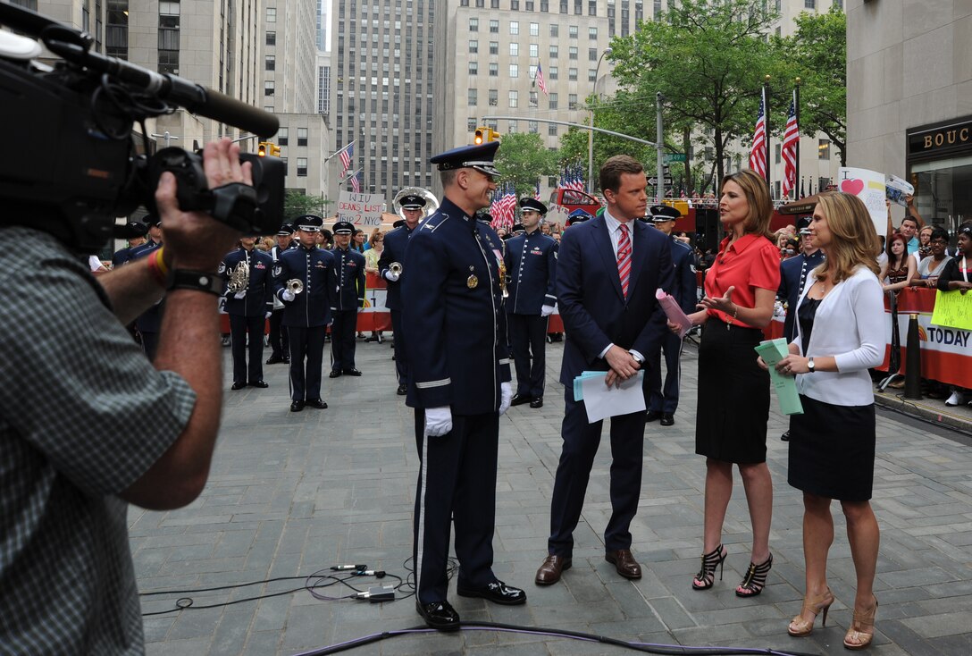 Col. A. Phillip Waite, commander and conductor of The U.S. Air Force Band informs the NBC’s Today Show anchors and their national audience, on the mission of his command during a live broadcast July 4 in New York. Following the interview, the band performed in celebration of Independence Day for the Today Show audience at the Rockefeller Center. (U.S. Air Force photo by Staff Sgt. Christopher Ruano)