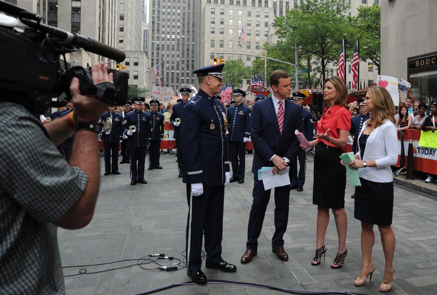 Col. A. Phillip Waite, commander and conductor of The U.S. Air Force Band informs the NBC’s Today Show anchors and their national audience, on the mission of his command during a live broadcast July 4 in New York. Following the interview, the band performed in celebration of Independence Day for the Today Show audience at the Rockefeller Center. (U.S. Air Force photo by Staff Sgt. Christopher Ruano)