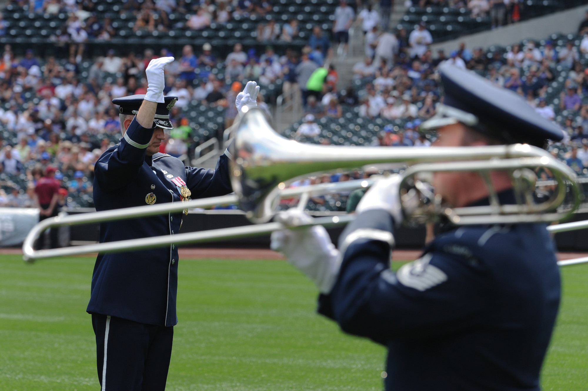 Col. A. Phillip Waite, commander and conductor of The U.S. Air Force Band, leads the ceremonial brass in the opening performance at the Mets vs. Yankees baseball game at Citi Field July 2 in New York.  July 4, 2011, marks the 235th anniversary of America’s break from British rule to create the United States of America. (U.S. Air Force photo by Staff Sgt. Christopher Ruano)