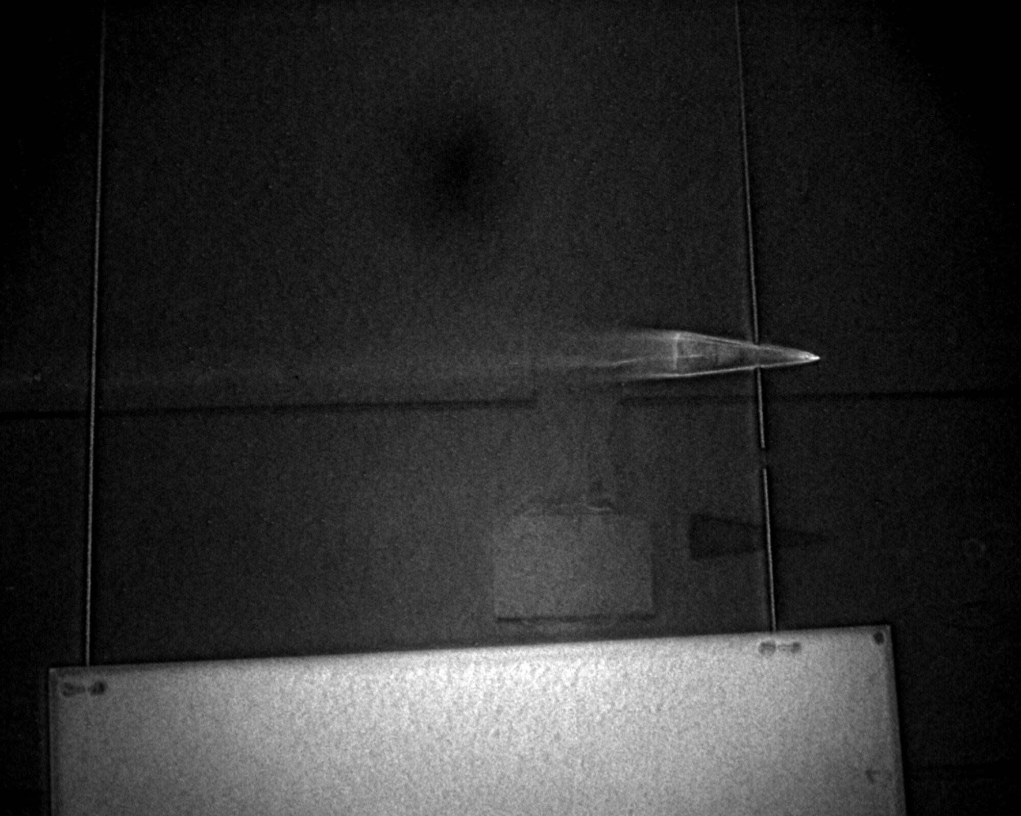 A successful checkout test June 8 at AEDC’s Hypervelocity Ballistics Range G captured this image of a projectile traveling at 18,000 feet per second. New cameras installed at the range use a digital format to capture images that are used to determine aerodynamic performance. (Photo provided)