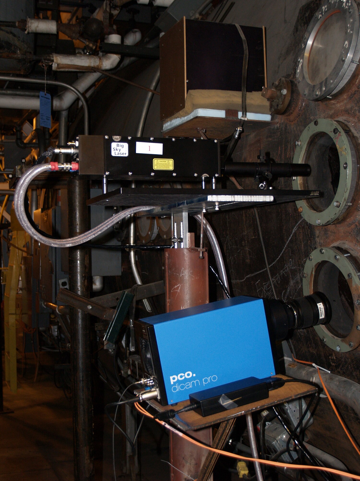 Three new laser camera systems have been installed at AEDC’s Hypervelocity Ballistics Range G. The new systems capture digital images of projectiles traveling at high speeds. A laser mounted at the top of the system illuminates the tank while a camera on the bottom captures the image. The new cameras replace film systems that were decades old. (Photo provided)