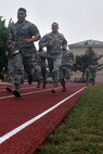 KUNSAN AIR BASE, Republic of Korea -- Airmen run the 880 yard course while participating in the Marine Corps Combat Fitness Test here July 1. The test consisted of movement to contact; 880 yard run, 30 pound ammunition lift and the maneuver under fire, which was a 300 yard shuttle run that includes a variety of combat-related tasks, to include: crawls, buddy drags and carries, ammunition resupply, grenade throw and agility running. (U.S. Air Force photo/Senior Airman Brittany Y. Bateman) 