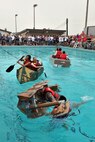 KUNSAN AIR BASE, Republic of Korea -- Airmen participate in the cardboard boat regatta during the “Fourth on the First” Independence Day celebration here July 1. It was one of many events held on base to celebrate America’s day of freedom. (U.S. Air Force photo/Senior Airman Brittany Y. Bateman)