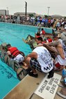 KUNSAN AIR BASE, Republic of Korea -- Airmen participate in the cardboard boat regatta during the “Fourth on the First” Independence Day celebration here July 1. It was one of many events held on base to celebrate America’s day of freedom. (U.S. Air Force photo/Senior Airman Brittany Y. Bateman)
