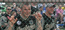 KUNSAN AIR BASE, Republic of Korea -- Staff Sgt. Robert Weng and Staff Sgt. Jacob See, 8th Security Forces Squadron defenders, “cheer and jeer” during the Chiefs vs. Eagles softball game here July 1. The hecklers, part of the infamous 8th SFS “Hate Train” cheering squad, harassed both teams during the game. The Eagles lost to the Chiefs, 22-12. (U.S. Air Force photo/Master Sgt. Sonny Cohrs)