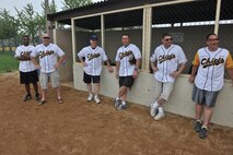 KUNSAN AIR BASE, Republic of Korea -- The Chiefs stand outside their dugout cheering on their teammates during the Chiefs vs. Eagles softball game here July 1. The softball game was part of the wing’s Independence Day celebration. (U.S. Air Force photo/Master Sgt. Sonny Cohrs)