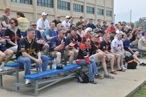 KUNSAN AIR BASE, Republic of Korea -- Men and women from the 8th Fighter Wing cheer during the Chiefs vs. Eagles softball game here July 1, kicking off the wing’s Independence Day celebration. (U.S. Air Force photo/Master Sgt. Sonny Cohrs)