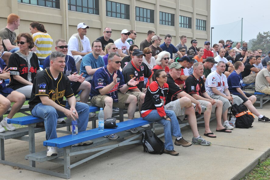KUNSAN AIR BASE, Republic of Korea -- Men and women from the 8th Fighter Wing cheer during the Chiefs vs. Eagles softball game here July 1, kicking off the wing’s Independence Day celebration. (U.S. Air Force photo/Master Sgt. Sonny Cohrs)