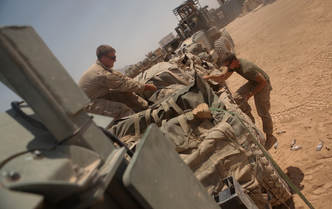 Marines with 3rd Battalion, 2nd Marine Regiment, strap down pallets of water on a 7-ton, flat-bed truck. The logistics train with the unit delivered supplied 68 pallets of water in a single day. That’s nearly 50,000 bottles of water delivered across the Musa ‘Qala district in 24 hours. ::r::::n::::r::::n::::r::::n::