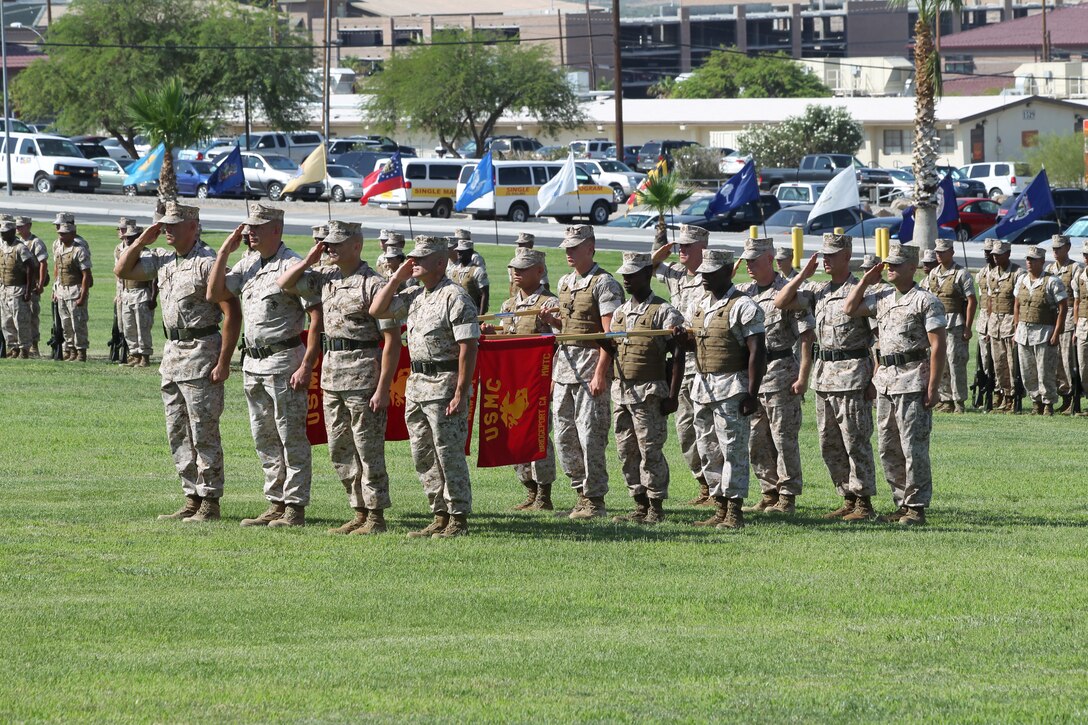 The commanding officers from each of the four units that make up Marine Air Ground Task Force Training Command conduct “Officers Center” during the commanding general’s change of command ceremony held at Lance Cpl. Torrey L. Gray Field July 7, 2011. The tactical purpose for “Officers Center” is to provide final instructions to commanders prior to battle. The ceremony signified the shift in command from Brig. Gen. H. Stacy Clardy III to Brig. Gen. George W. Smith Jr.::r::::n::
