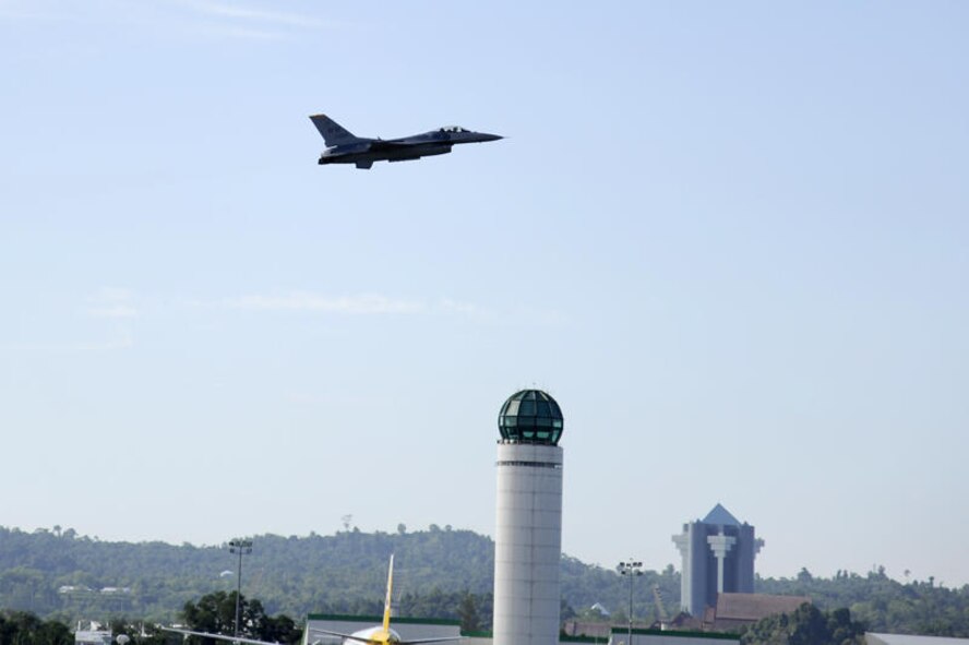 Brunei Darussalam -- Capt. Chris Nations, Pacific Air Forces Demonstration Team pilot, flies over Rimba Air Base after take-off during an aerial show practice for the 3rd Biennial Brunei Darussalam International Defense Exhibition in Brunei Darussalam July 3. This year coincides with the 50th anniversary of the Royal Brunei Armed Forces and is forecasted to host more than 160 exhibitors and 150 international delegates. (U.S. Air Force photo/Staff Sgt. Marie Brown/Released)