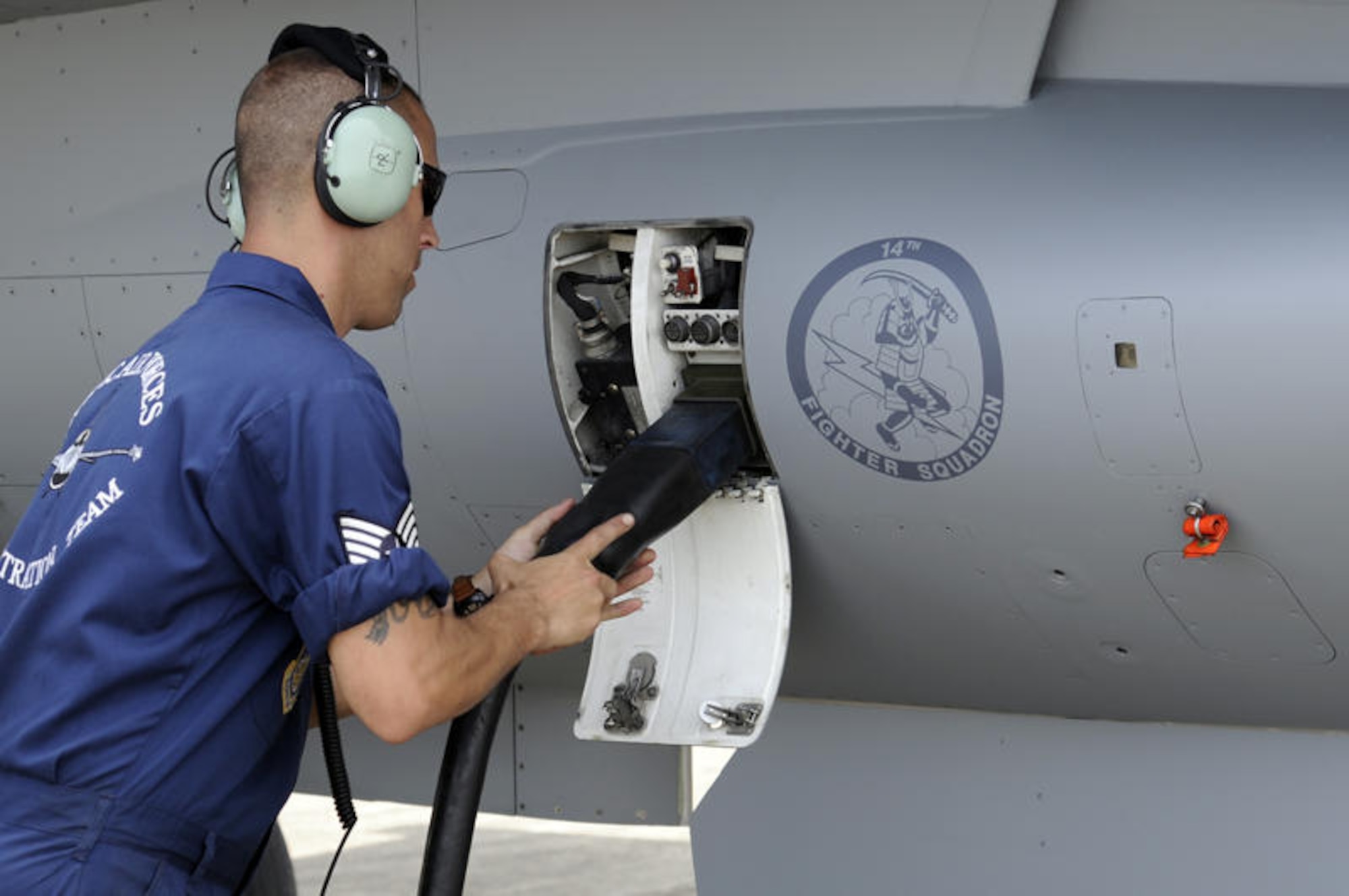 RIMBA AIR BASE, Brunei -- Staff Sgt. Nathan Bolander, Pacific Air Forces Demo Team member, connects external power to a F-16 Fighting Falcon at Rimba Air Base July 2. Two F-16's along with 15 members from the 35th Fighter Wing arrived in Brunei July 1 to prepare for the 3rd Biennial Brunei Darussalam International Defense Exhibition 2011 scheduled for July 6-9. (U.S. Air Force photo/Staff Sgt. Marie Brown/Released)