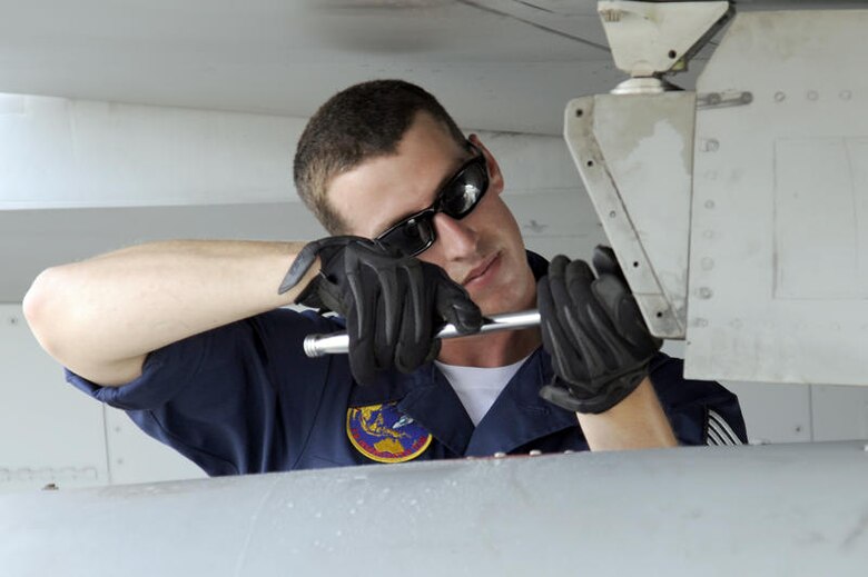 RIMBA AIR BASE, Brunei -- Staff Sgt. Jonathon Crocker, Pacific Air Forces Demonstration Team member, works to remove a fuel tank from a F-16 Fighting Falcon at Rimba Air Base, Brunei July 2. The PACAF Demonstration Team along with other members of the 35th Fighter Wing are participating in the 3rd Biennial Brunei Darussalam International Defense Exhibition 2011 scheduled for July 6-9 for the first time. (U.S. Air Force photo/Staff Sgt. Marie Brown/Released)
