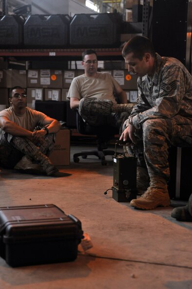 KUNSAN AIR BASE, Republic of Korea -- Readiness support team trainees receive hands on training from Staff Sgt. Jonathan Dobson, 8th Civil Engineer Squadron emergency management, here July 7. The readiness flight plans for and assists in protecting people and assets during disasters, major accidents and hostile actions. (U.S. Air Force photo/Senior Airman Brittany Y. Bateman)
