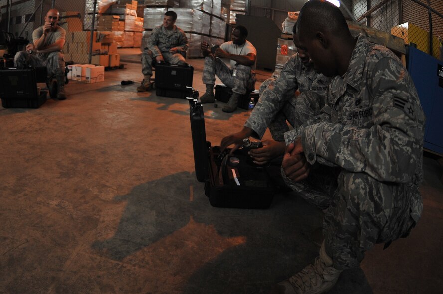 KUNSAN AIR BASE, Republic of Korea -- Readiness support team trainees receive hands on training from Senior Airman Bryan Scott, 8th Civil Engineer Squadron emergency management journeyman, here July 7. The readiness flight helps ensure rapid response to and recovery from the effects of such incidents. (U.S. Air Force photo/Senior Airman Brittany Y. Bateman)