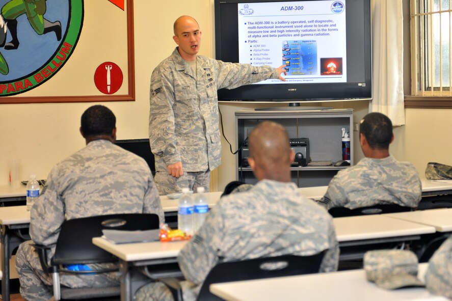 KUNSAN AIR BASE, Republic of Korea -- Senior Airman Bryan Scott, 8th Civil Engineer Squadron emergency management journeyman, briefs Airmen who will be a part of the readiness support team here July 7. The readiness flight helps ensure rapid response to and recovery from the effects of such incidents. (U.S. Air Force photo/Senior Airman Brittany Y. Bateman)