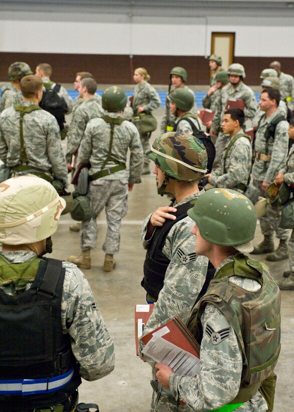Airmen take personnel accountability prior to being transported to the Pride Hangar during a Phase I Operational Readiness Exercise on Ellsworth Air Force Base, S.D.,  June 21, 2011. Out of the five major inspected areas, deployment processing is key to the overall success of the ORE. (U.S. Air Force photo/Airman Alystria Maurer/Released)