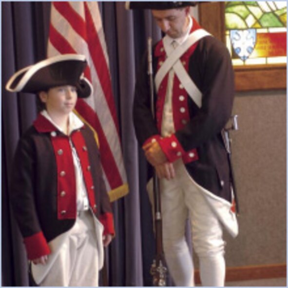 Asael Horne (left) and Benjamin Horne wear Colonial Army uniforms appropriate to the period at the "Let Freedom Ring" National Bell Ringing ceremony July 4 at the Nate Mazer Memorial Chapel at the Hill Aerospace Museum. (U.S. Air Force photo by Anne Morrison)