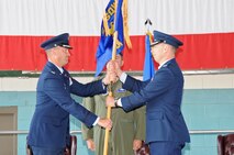 Col. James Cardoso, 58th Special Operations Wing commander, left, passes the guidon to Col. Dagvin Anderson, the new 58th Operations Group commander, July 5 during a change of command ceremony.

Photo by Dennis Carlson