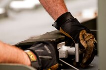 A member of the 76th Aerial Port Squadron, here, prepares a K-loader to receive pallets of medical equipment and supplies, school furniture, clothes and other donated items for transport to Honduras. Provided by local charity Mission of Love, the items are scheduled to be shipped via a KC-10 provided by the 514th Air Mobility Wing, Joint Base McGuire-Dix-Lakehurst, New Jersey. The mission was arranged using the Denton program, which allows private U.S. citizens and organizations to use space available on U.S. military cargo planes to transport humanitarian goods, such as clothing, food, medical and educational supplies, and agricultural equipment and vehicles, to countries in need. 