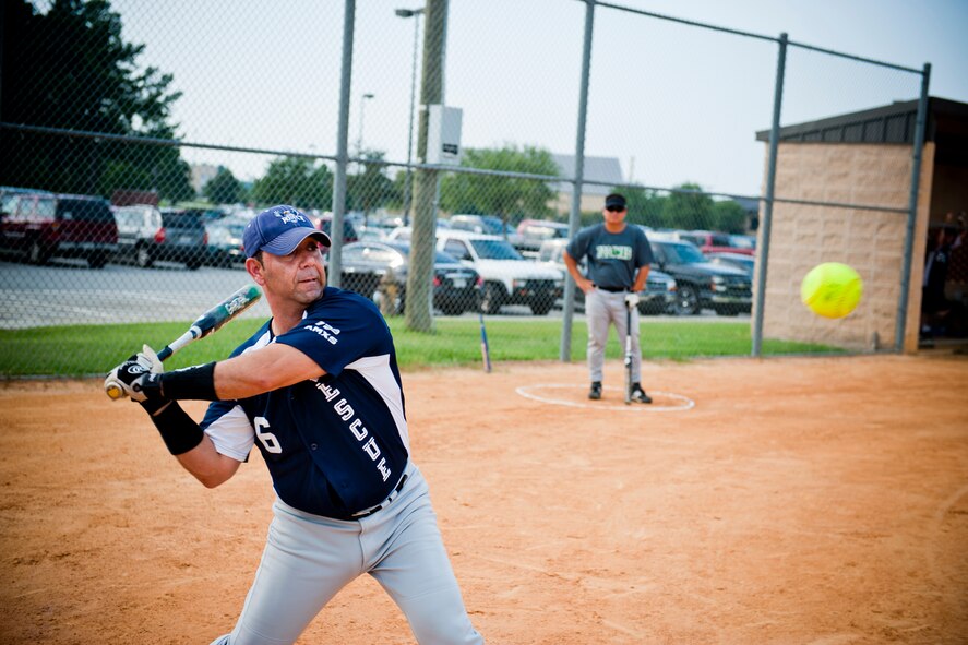 Moses Perez, 723rd Aircraft Maintenance Squadron, attempts a swing at bat during an intramural softball game at Moody Air Force Base, Ga., July 6, 2011. Perez scored two runs during the game, helping his team defeat the 23rd Component Maintenance Squadron 12-3. (U.S. Air Force photo by Jamal D. Sutter/Released) 