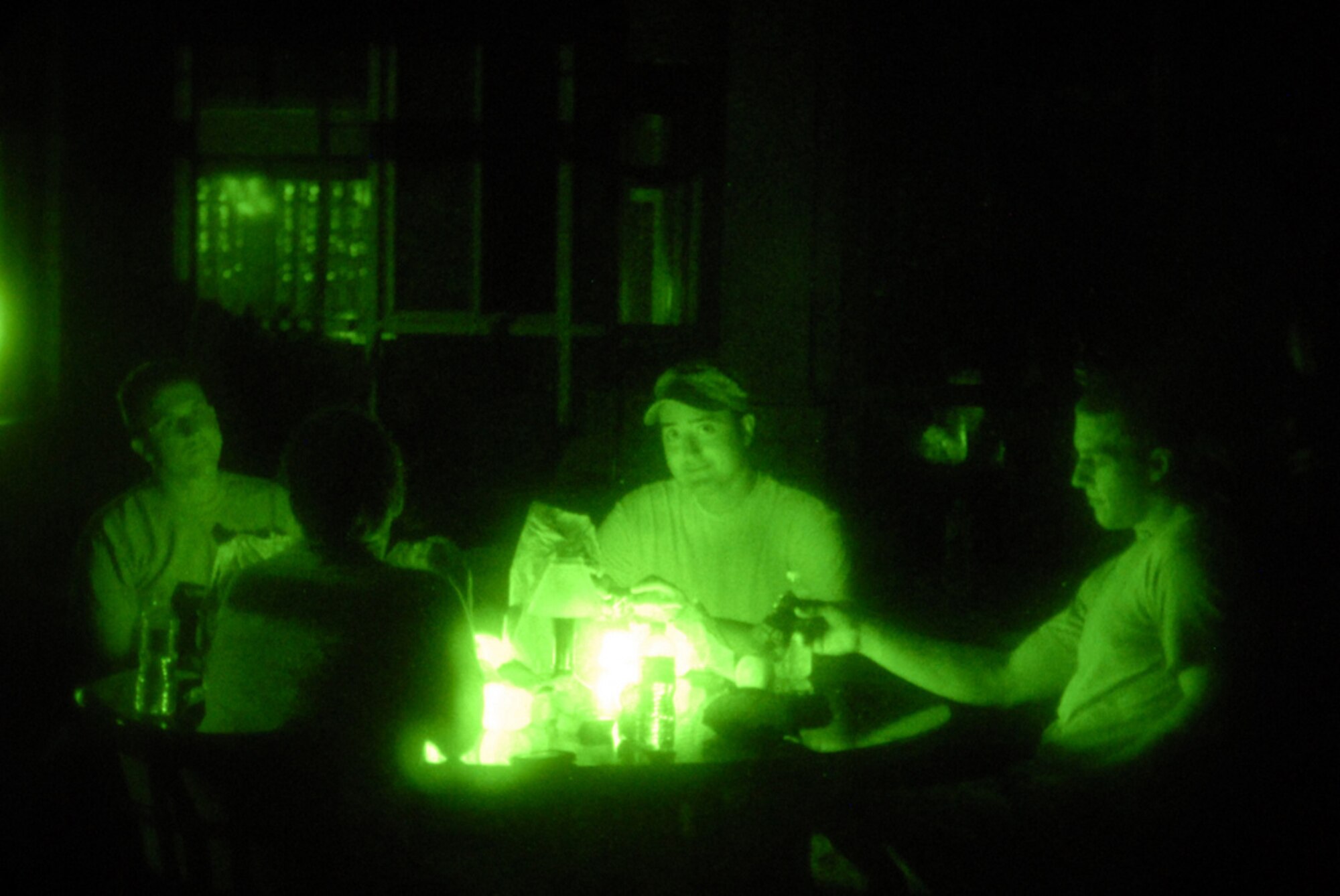 DAKOTA DUNES, S.D. - Airmen from the South Dakota Air National Guard's 114th Fighter Wing, Sioux Falls, enjoy a midnight snack while taking a break from their levee patrol duties here June 29.  The Airmen are patrolling the levee in support of the Southeast South Dakota Flood Incident.  (Photo by Tech. Sgt. Quinton Young)(RELEASED)