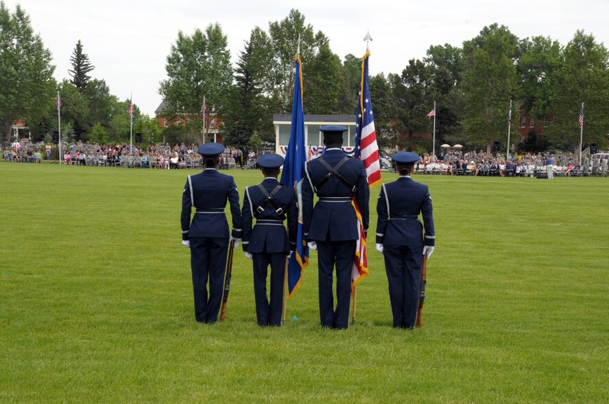 Members of the F. E. Warren Air Force Base honor guard prepare to present the colors before those gathered on the Argonne Parade Field for the 90th Missile Wing's change-of-command ceremony to welcome Col. Christopher Coffelt, 90th MW commander. (U.S. Air Force photo by Blaze Lipowski)