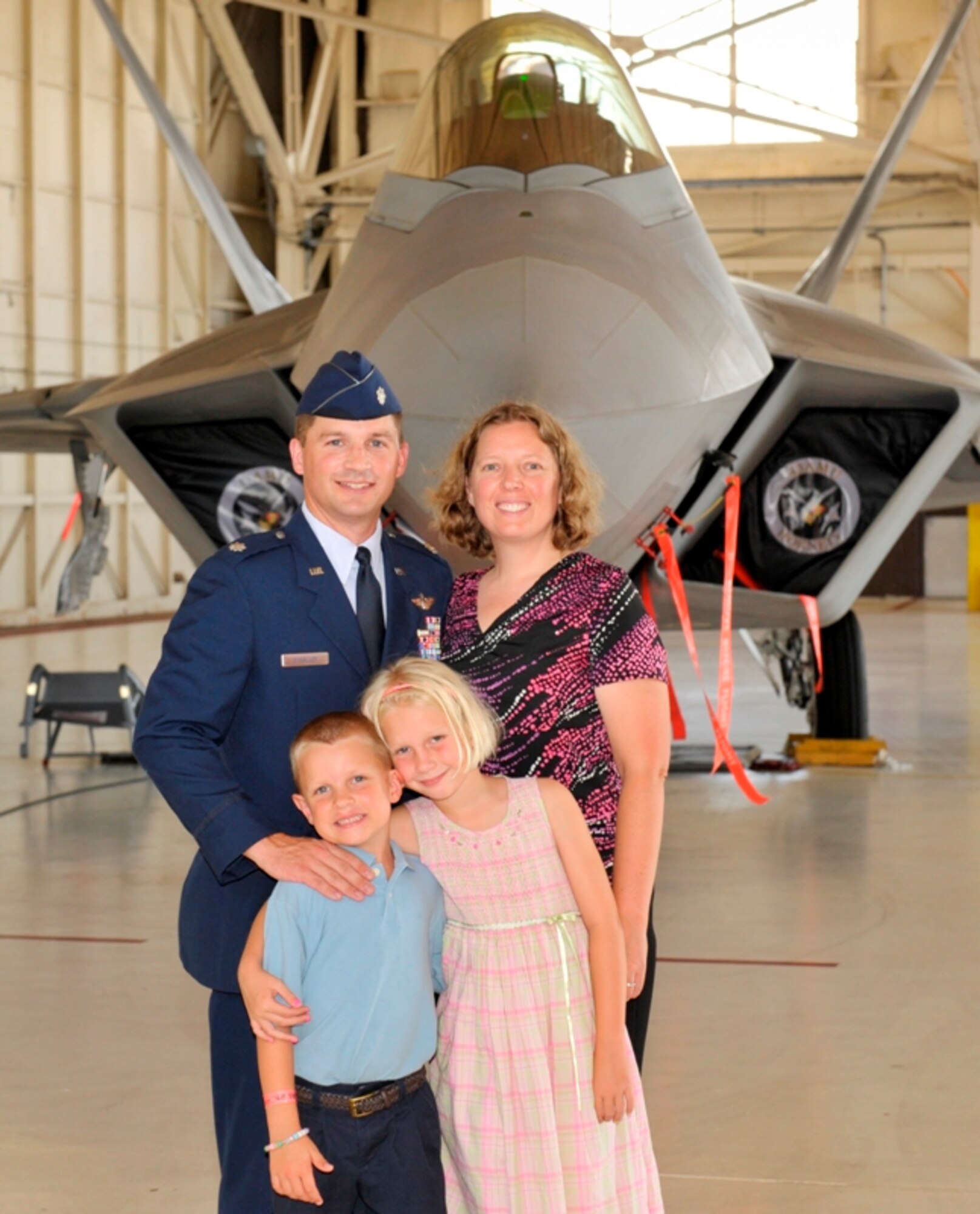 Lieutenant Col. David O’Malley, 325th Operations Support Squadron commander, his wife, AnnMarie, and their two children Caden (left) and Ashlan (right), after the change of command ceremony June 17. (Courtesy photo)  