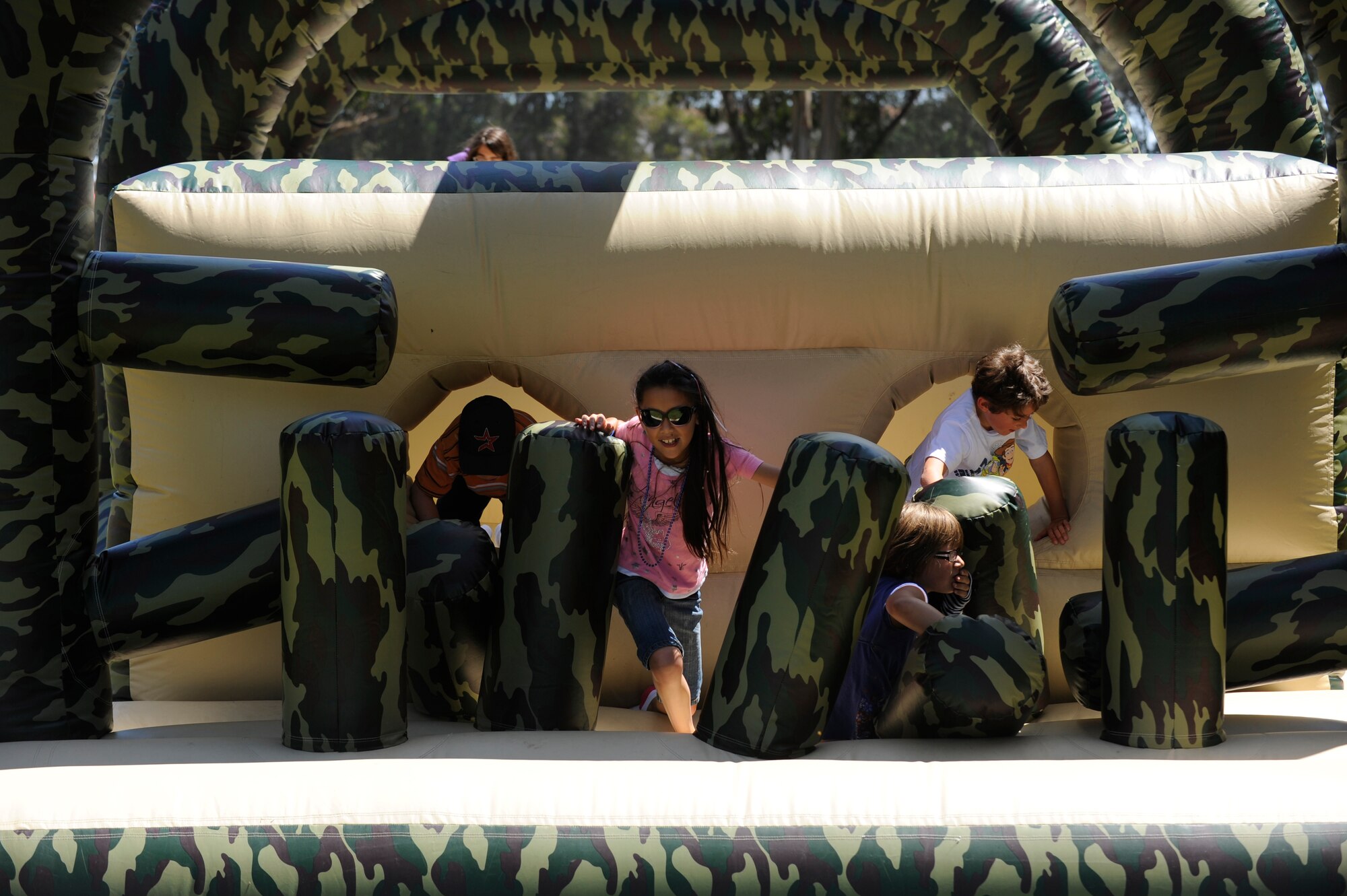 VANDENBERG AIR FORCE BASE, Calif. -- Team V children play on an obstacle course during an Independence Day picnic at Cocheo park here Saturday, July 2, 2011.  (U.S. Air Force photo/Staff Sgt. Andrew Satran) 

  
  