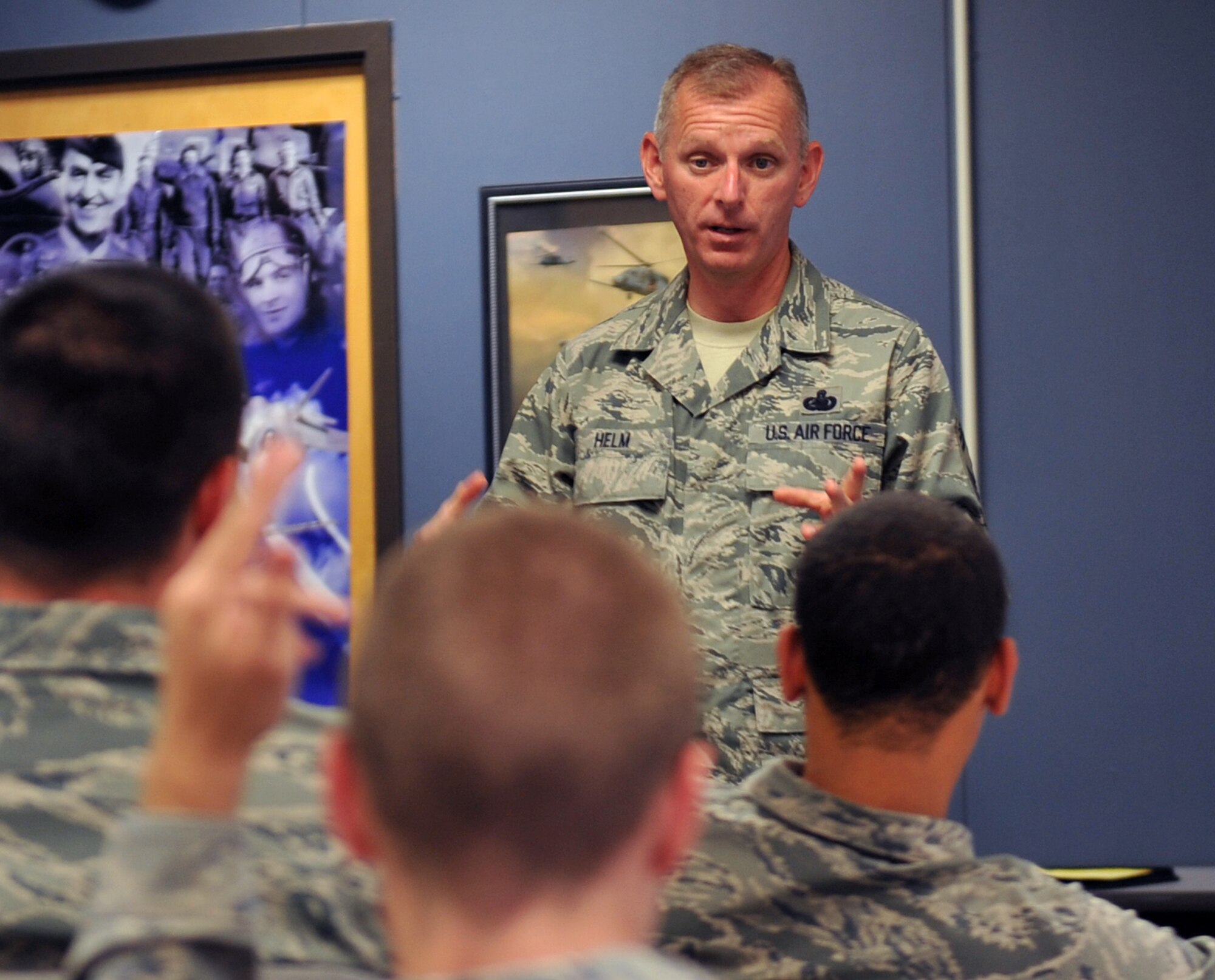 Air Force Chief Master Sgt. Jeffry Helm speaks to Airmen at the First Term Airmen Center on June 23, 2011 at the Offutt Air Force Base, Neb.  Chief Master Sgt. Helm also asked questions about food service throughout the different bases around the world and awarding them with prizes for the correct answer. Chief Master Sgt. Helm is visiting bases throughout the world to find out what the Exchange can do to better serve its customers and fix existing problems. (U.S. Air Force photo by Jeff W. Gates/Released)