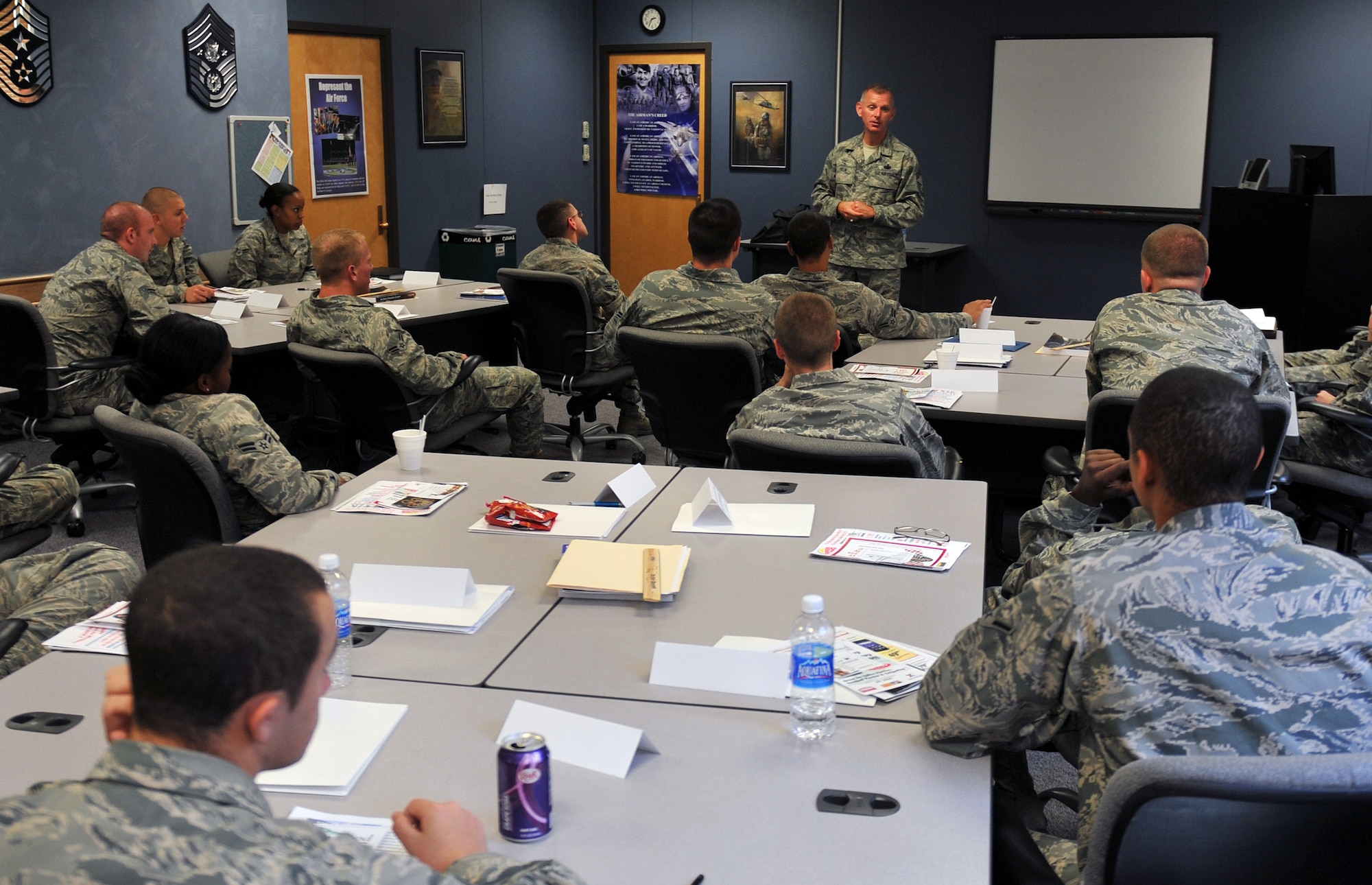 Air Force Chief Master Sgt. Jeffry Helm speaks to Airmen at the First Term Airmen Center on June 23, 2011 at the Offutt Air Force Base, Neb.  Chief Master Sgt. Helm also asked questions about food service throughout the different bases around the world and awarding them with prizes for the correct answer. Chief Master Sgt. Helm is visiting bases throughout the world to find out what the Exchange can do to better serve its customers and fix existing problems. (U.S. Air Force photo by Jeff W. Gates/Released)