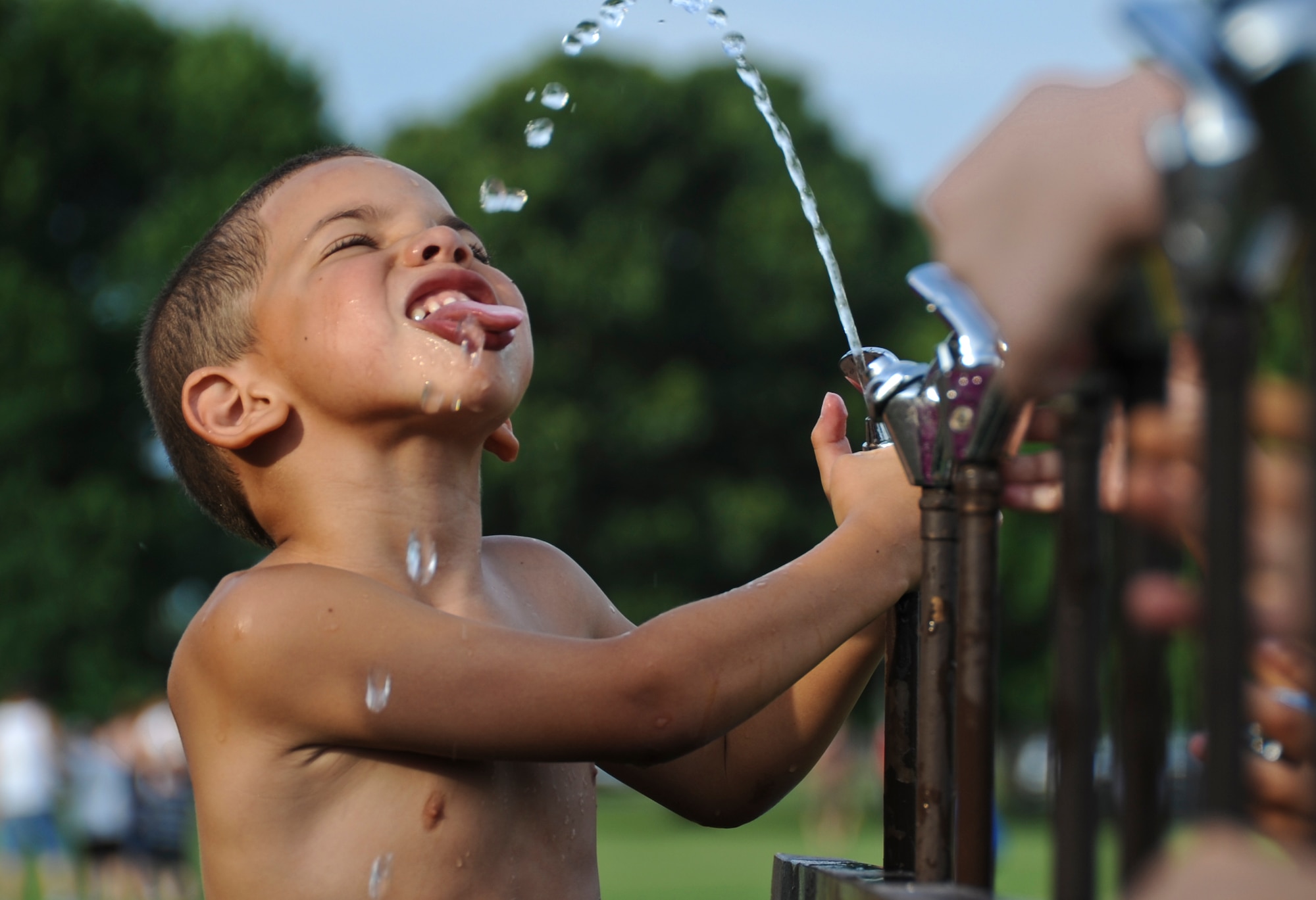 JOINT BASE MCGUIRE-DIX-LAKEHURST, N.J. -- Kason, 5, tries to beat the heat during the Fourth of July celebration on Dix. Kason is the son of Senior Airman Joshua Lattimore, 818th Global Mobility Squadron. (U.S. Air Force photo by Senior Airman David Carbajal/Released)