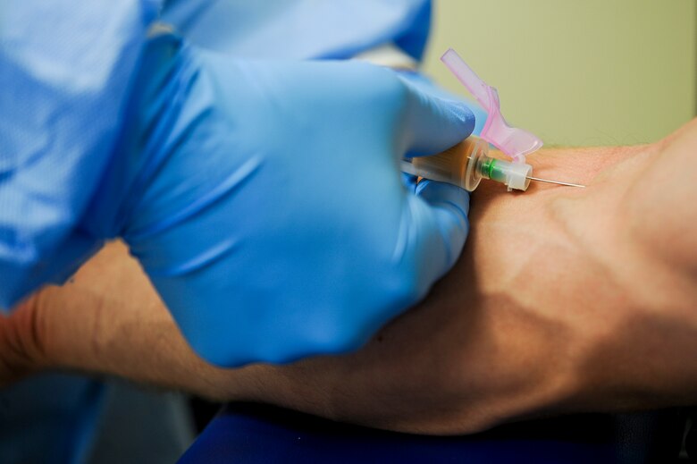 SEYMOUR JOHNSON AIR FORCE BASE, N.C. – A medical technician draws blood from a patient’s arm during a preventive health assessment appointment in the Family Medicine Clinic here June 21, 2011. The blood is sent to the laboratory for testing. Blood work is required to test for cholesterol levels, HIV and other various medical issues. (U.S. Air Force photo by Tech. Sgt. Colette M. Graham/Released)