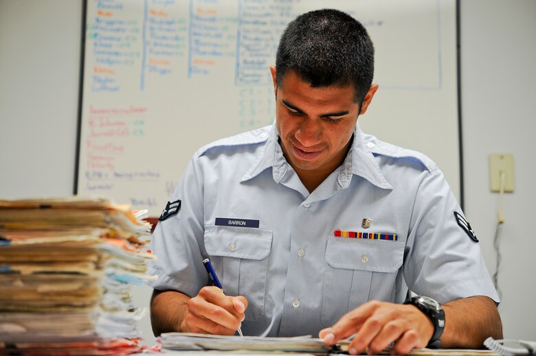 SEYMOUR JOHNSON AIR FORCE BASE, N.C. – Aerospace medical technician Airman 1st Class Juan Barron, 4th Medical Operations Squadron, reviews and updates patients’ medical records in the Family Medicine Clinic here June 20, 2011. Forms in the medical records need to be updated daily so patients can take them on deployments at a moment’s notice. Barron hails from Rock Falls, Illi. (U.S. Air Force photo by Tech. Sgt. Colette M. Graham/Released)