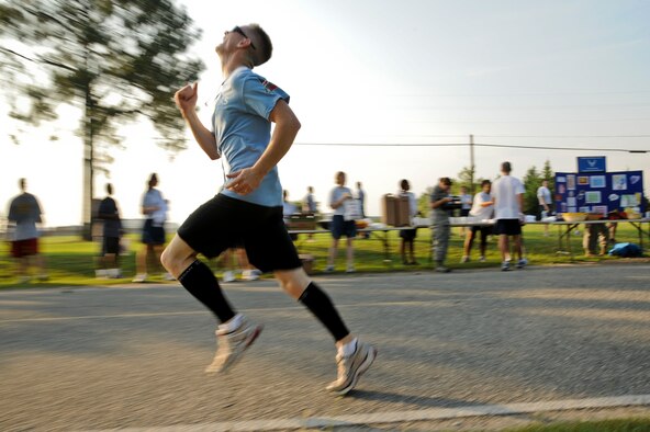 SEYMOUR JOHNSON AIR FORCE BASE, N.C. – Munitions equipment maintenance crew chief Airman 1st Class Dustin Nadjkovic, 4th Equipment Maintenance Squadron, runs toward the finish line on perimeter road during the Freedom Run here June 30, 2011. Nadjkovic finished the 10K in 50 minutes and hails from Hesperia, Mich. (U.S. Air Force photo by Tech. Sgt. Colette M. Graham/Released)