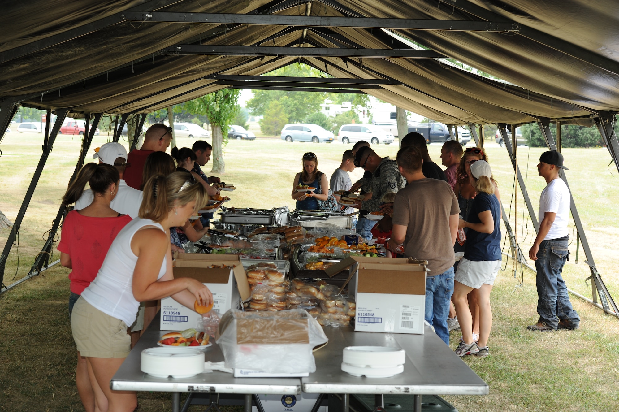 Team Dover members line up for free food during the Wing’s 4th of July Picnic.  The event also included inflatable rides and a live band.  (U.S. Air Force photo by Staff Sgt. Chad Padgett)
