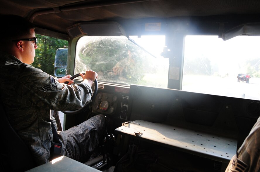 Senior Airman Bryan Bell, 2nd Civil Engineer Squadron Explosive Ordinance Disposal, drives a HUMVEE transporting EOD personnel to the bomb range located on Barksdale Air Force Base, La., July 5. Personnel from EOD performed a bomb demonstration for 2nd Bomb Wing leadership for informative purposes and also served as an opportunity for EOD Airmen to get their monthly range qualification. (U.S. Air Force photo/Senior Airman Joanna M. Kresge) 
