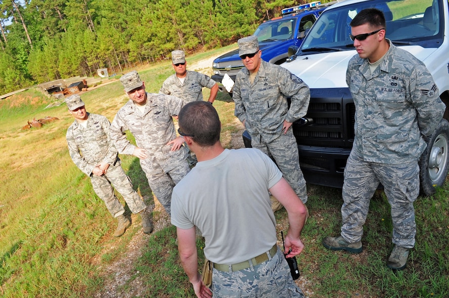 Tech. Sgt. Bart Matthews, 2nd Civil Engineer Squadron Explosive Ordinance Disposal, briefs 2nd Bomb Wing leadership on the EOD bomb range safety procedures prior to a bomb demonstration on Barksdale Air Force Base, La., July 5. The demonstration not only informed base leadership about EOD procedures, it allowed EOD personnel to get their monthly range qualification. (U.S. Air Force photo/Senior Airman Joanna M. Kresge) 
