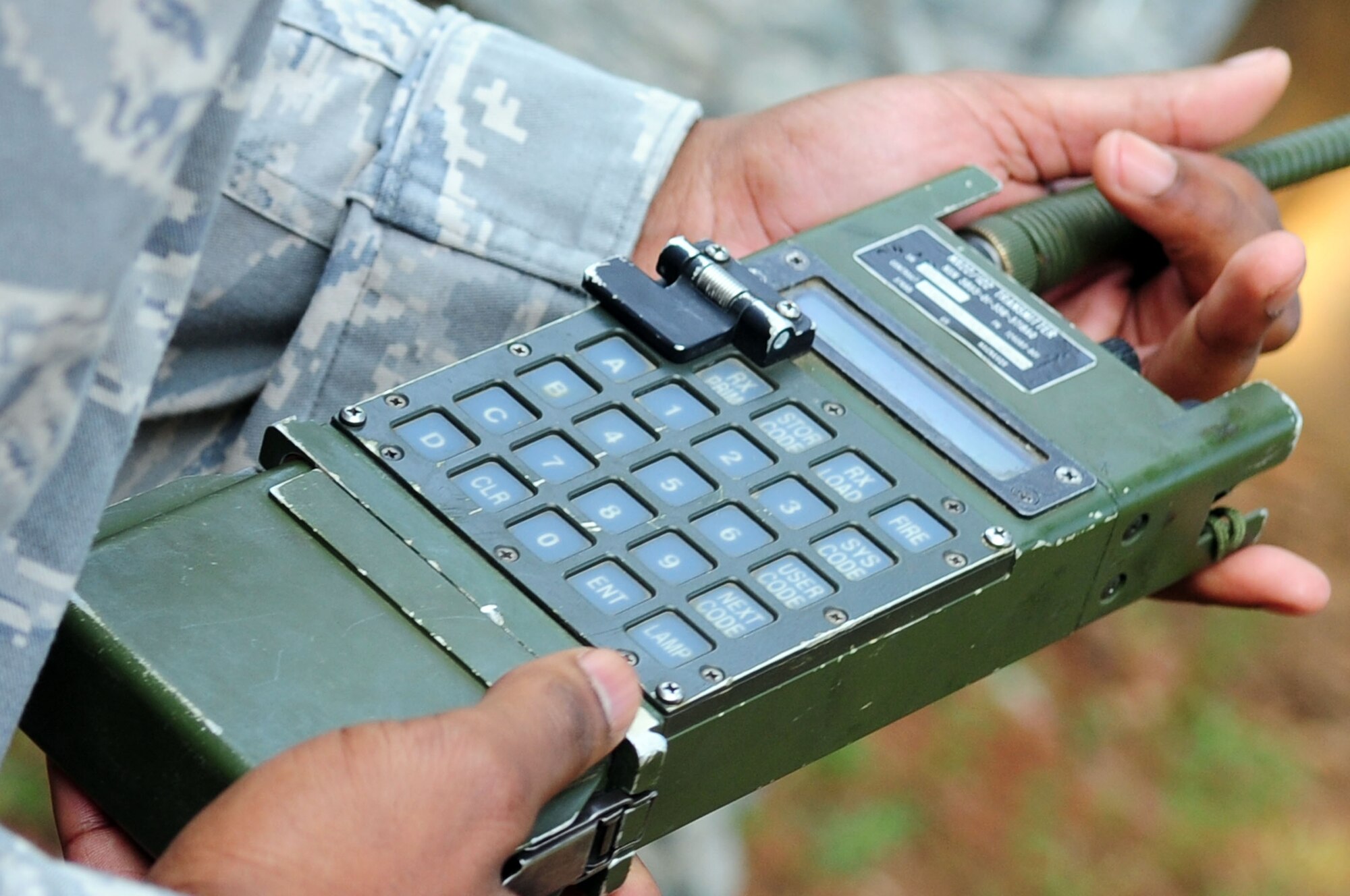 Staff Sgt. Martin Strom, 2nd Civil Engineer Squadron Explosive Ordinance Disposal, instructs Col. Tim Fay, 2nd Bomb Wing commander, how to properly detonate a bomb during a bomb demonstration on an EOD range located on Barksdale Air Force Base, La., July 5. The demonstration not only informed base leadership about EOD procedures, it allowed EOD personnel to get their monthly range qualification. (U.S. Air Force photo/Senior Airman Joanna M. Kresge) 
