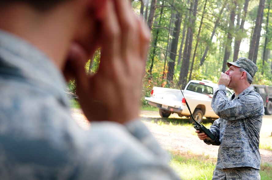 Col. Tim Fay, 2nd Bomb Wing commander, yells "fire in the hole," prior to detonating a bomb during a bomb demonstration on an Explosive Ordinance Disposal range located on Barksdale Air Force Base, La., July 5. Yelling the words "fire in the hole" three times prior to detonation is an EOD policy to alert the range that an explosion is about to occur. (U.S. Air Force photo/Senior Airman Joanna M. Kresge)