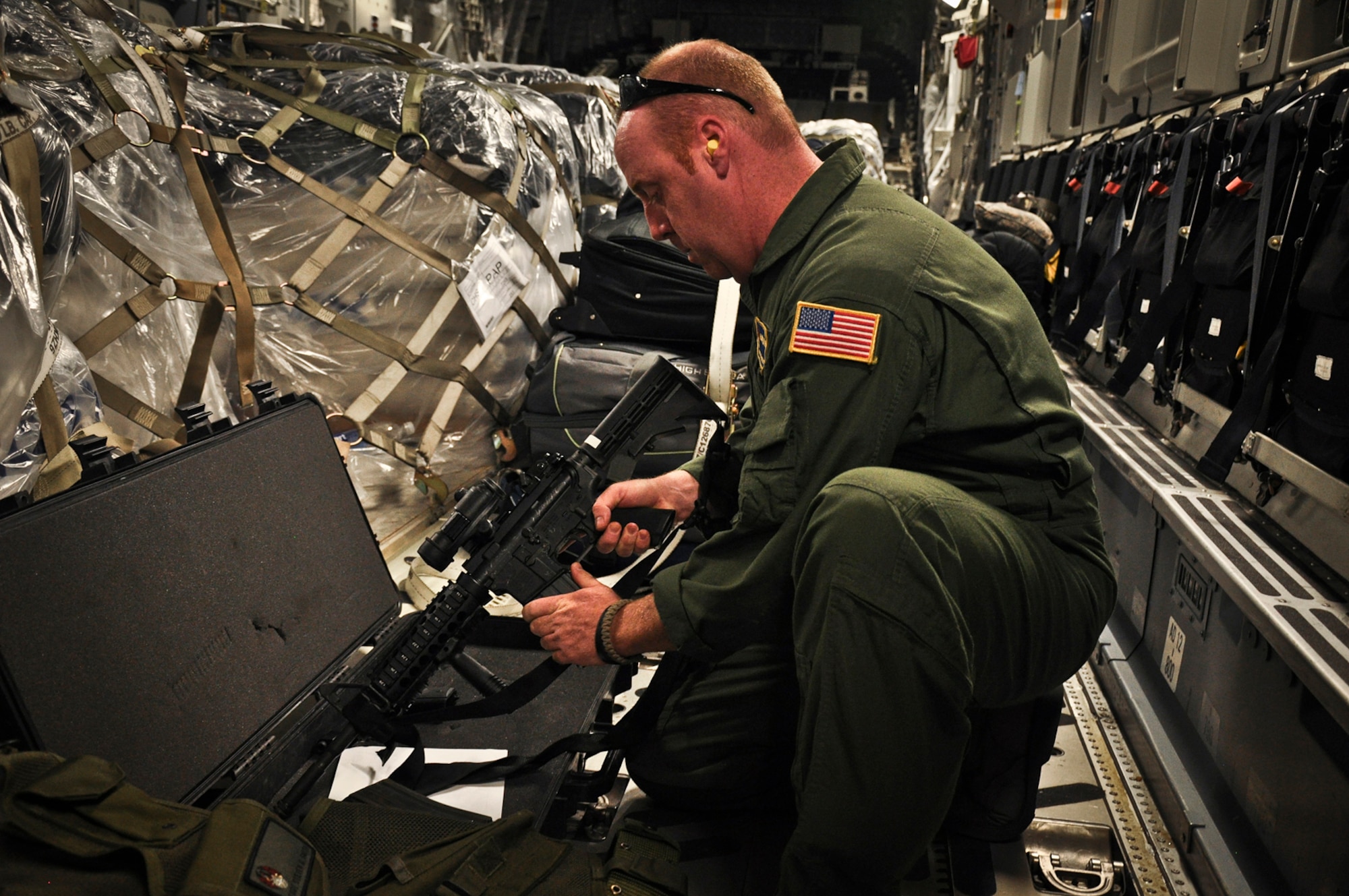 Technical Sergeant Steven Smith loads a magazine into an M-4 Carbine in preparation for the days airfield security mission. Sgt. Smith is Raven assigned to  the 315th Airlift Wing. (U.S. Air Force photo by Staff Sgt. Rashard Coaxum)