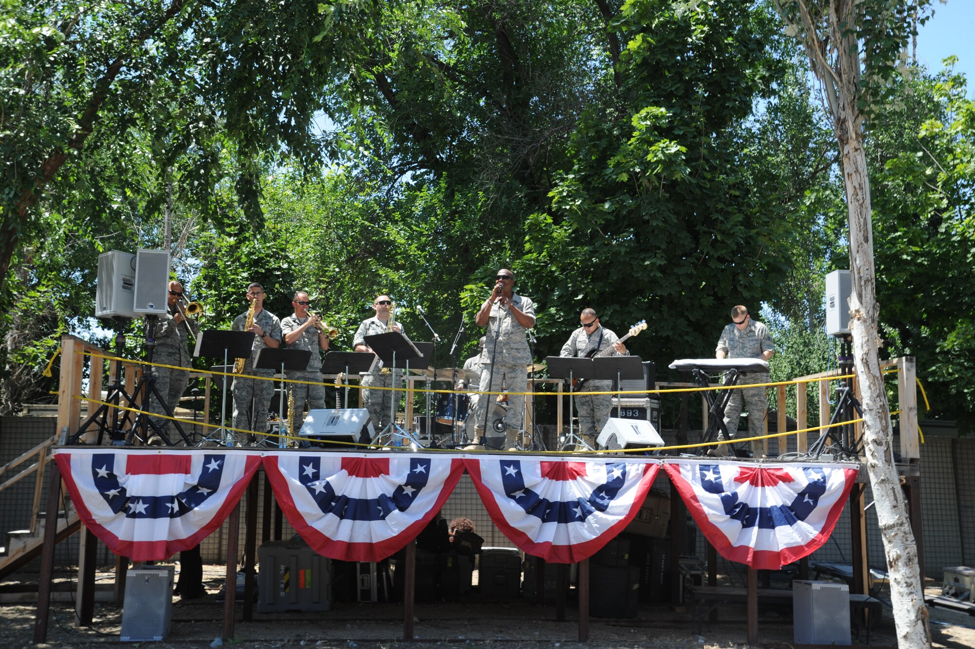 TRANSIT CENTER AT MANAS, Kyrgyzstan – “Blue Hawk” performs during the Transit Center at Manas’ Independence Day celebration here July 3. The Air Forces Central Command Band “Blue Hawk” spent the weekend leading up to Independence Day, and the holiday, performing for Americans and Kyrgyz citizens at the U.S. Embassy, the Transit Center, in the nation’s capital Bishkek and a cancer center.  (U.S. Air Force photo/Staff Sgt. Matthew Smith)