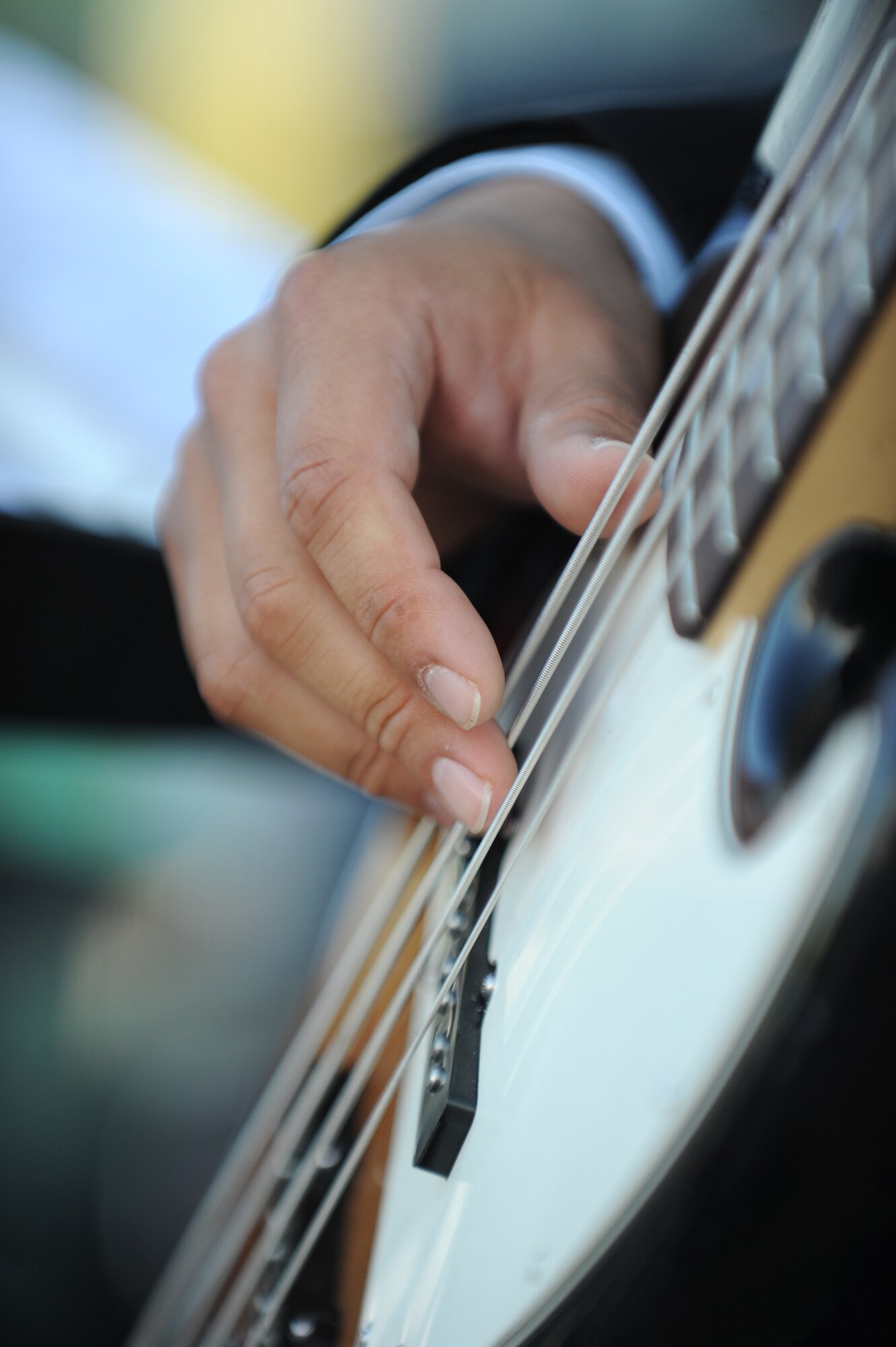 BISHKEK, Kyrgyzstan – Tech. Sgt. Marc Perez plays the bass guitar during the American Embassy’s official Fourth of July celebration here July 1. The Air Forces Central Command Band “Blue Hawk” spent the weekend leading up to Independence Day, and the holiday, performing for Americans and Kyrgyz citizens at the U.S. Embassy, the Transit Center, in the nation’s capital Bishkek and a cancer center. Perez is a guitarist and tubist with the band deployed from Naval Air Station Fort Worth Joint Reserve Base, Texas. (U.S. Air Force photo/Staff Sgt. Matthew Smith)