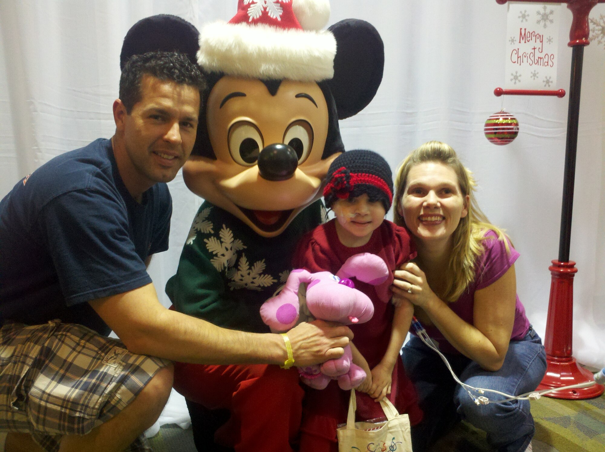 Master Sgt. Joe Herrera and his wife Jenna, pause for a moment with their children 7-year-old McKinley and 5-year-old Kaliana.  Kaliana has Spina Bifida, a defect that involves the incomplete development of the spinal cord.  Kaliana has endured five surgeries thus far with Sgt. Herrera having left Afghanistan two times on emergency leave to support his family.  Sgt. Herrera is a helicopter crew chief with the 440th Air Expeditionary Advisory Squadron.  (Air Force courtesy photo provided by Master Sgt. Joe Herrera)