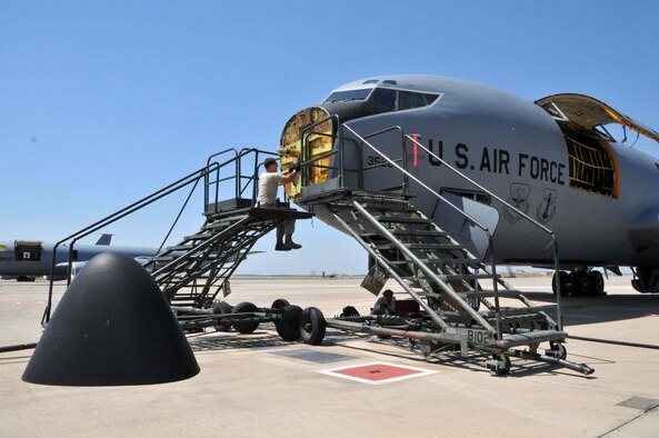 Senior Airman Joseph A. Moran (left) and Airman 1st Class Zina R. Allred work as a team replacing an antenna pedestal on the color weather radar of a KC-135 Stratotanker at the 313th Air Expeditionary Wing on July 5, 2011, in Western Europe.
