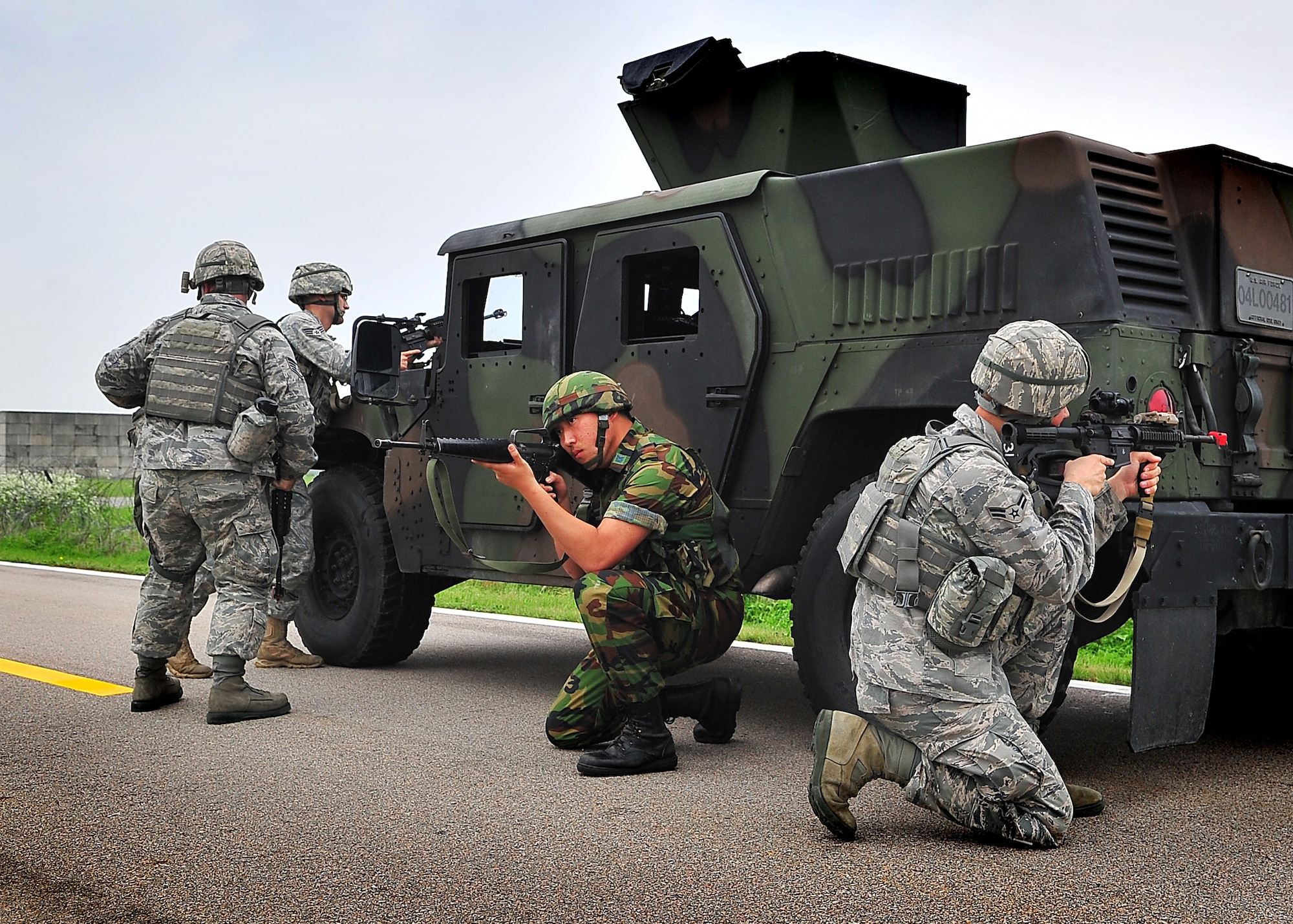 Members of the 51st Security Forces Squadron performed mounting and un-mounting operations training during the combat readiness course at Osan Air Base, June 27.  During training, SF members' reacted to [simulated] improvised explosive devices as well as [hostile] contact left and right drills.  Security Forces members are responsible for ensuring the safety of bases, weapons, property and personnel from hostile forces.