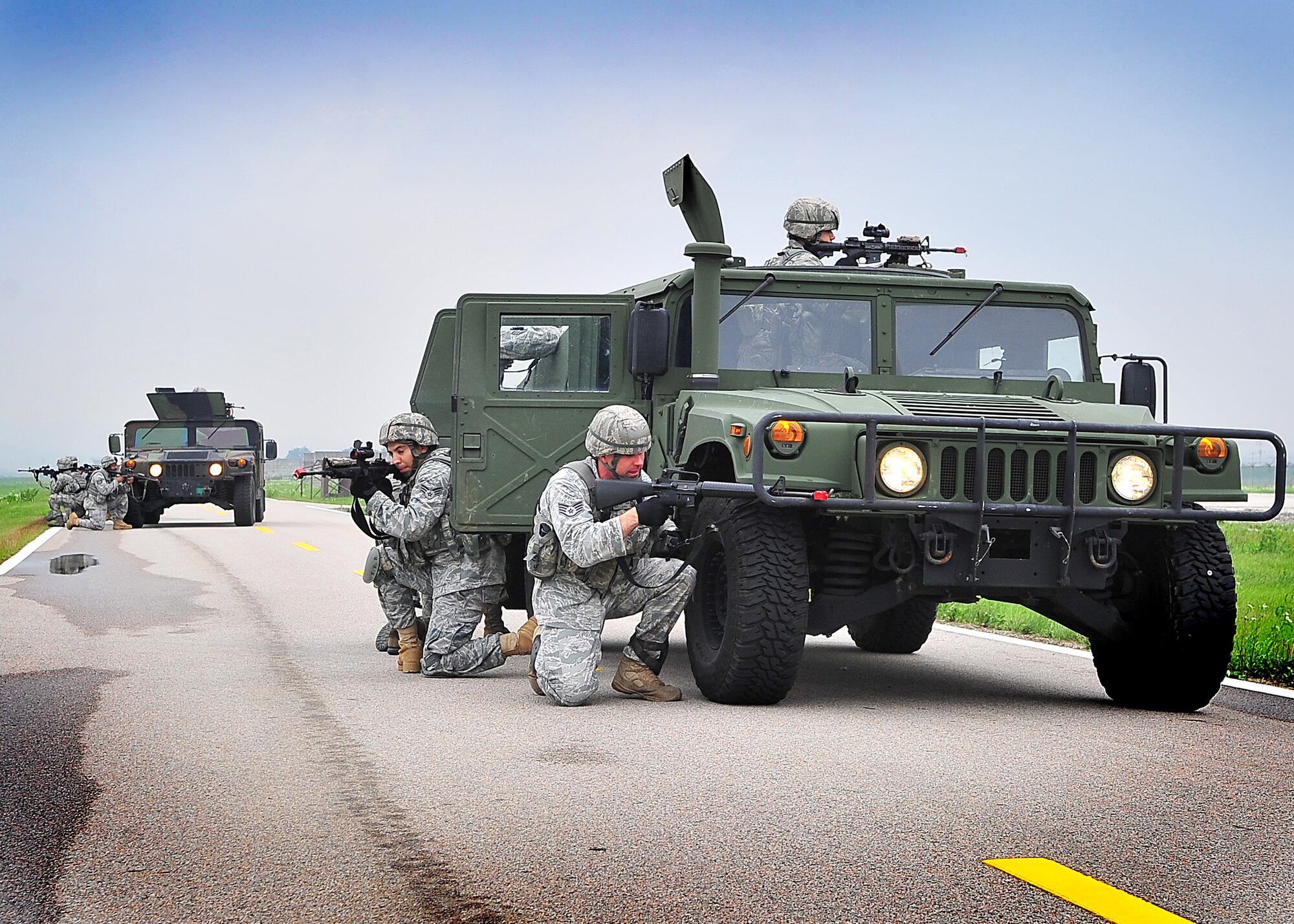 Members of the 51st Security Forces Squadron performed mounting and un-mounting operations training during the combat readiness course at Osan Air Base, June 27.  During training, SF members' reacted to [simulated] improvised explosive devices as well as [hostile] contact left and right drills.  Security Forces members are responsible for ensuring the safety of bases, weapons, property and personnel from hostile forces.